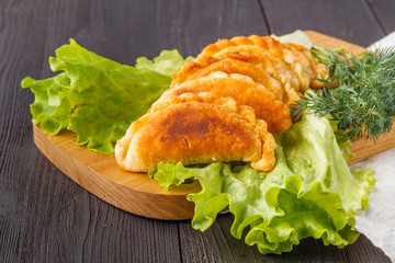 Belyash, meat pie, a glass of milk