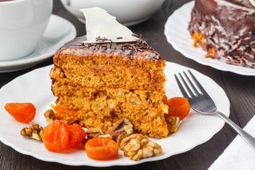 Slice of layered honey cake. Russian cake Medovik with walnuts