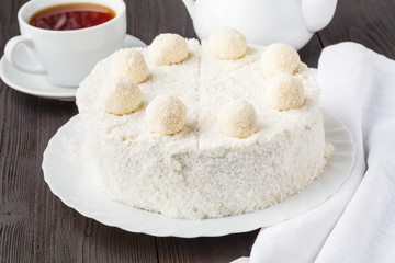 Homemade gluten-free honey layered cake with cream and nuts