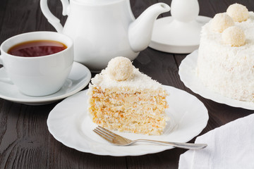 Homemade gluten-free honey layered cake with cream and nuts