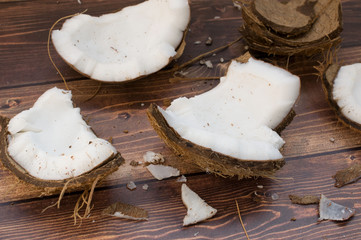 Slices of coconut on a wooden brown board