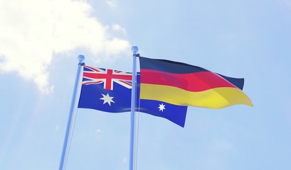 Australia and Germany, two flags waving against blue sky. 3d image