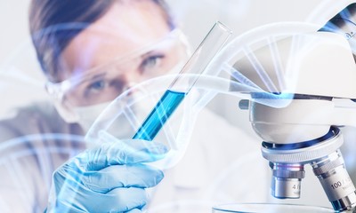 Fototapeta premium Young female scientist standing in her lab.