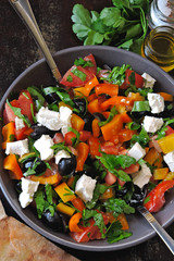 Middle Eastern salad with olives, feta and parsley. Healthy colorful vegetarian salad. Fresh arabic salad. Keto diet.