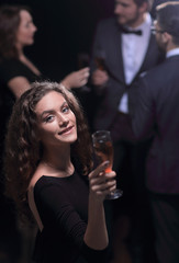 stylish young woman with glass of champagne