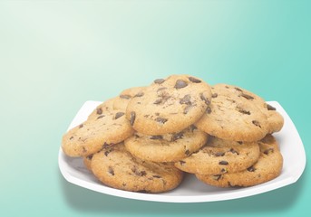 Plate of chocolate chip cookies isolated on white background