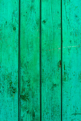 Fototapeta na wymiar Old wooden background of boards with cracked and peeling paint