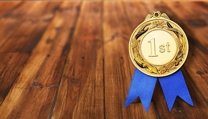 Gold medal with  ribbon  on  background