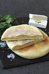 Pita with feta and greens. Arab lavash Middle Eastern cuisine.