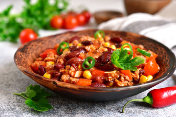 Chili con carne - minced meat stew with red bean and tomato.Traditional dish of mexican cuisine.