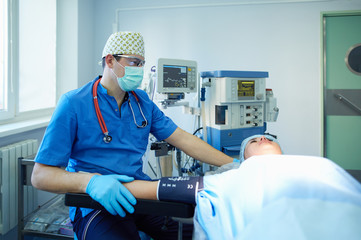 Man surgeon at work in operating room
