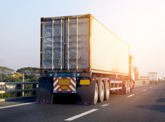 Naklejka premium White Truck on highway road with container, transportation concept.,import,export logistic industrial Transporting Land transport on the asphalt expressway