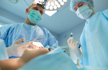 Team surgeon at work in operating room