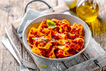 Italian spaghetti with tomato sauce served on plate