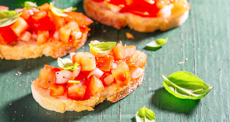 Classic italian bruschetta served on wooden board