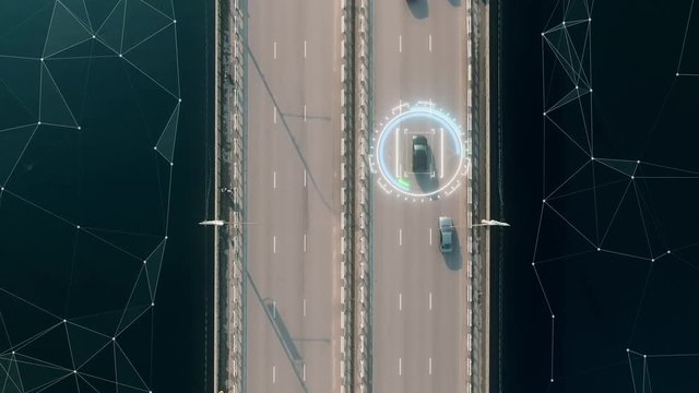 4k aerial view of self driving autopilot cars driving on a highway with technology tracking them, showing speed and who is controlling the car. Visual effects clip shot.