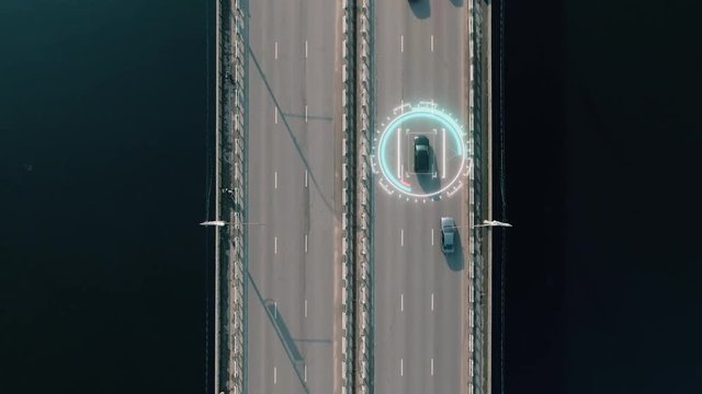 4k aerial view of driverless or autonomous car. Traffic passing by a highway. Plate number, speed limit and ID number displaying. Future transportation. Artificial intelligence. Self driving.