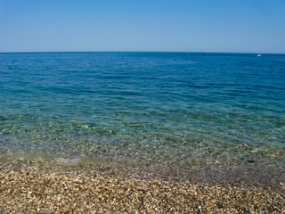 Calm sea without waves. Horizon at sea. Turkey, the Mediterranean Sea.