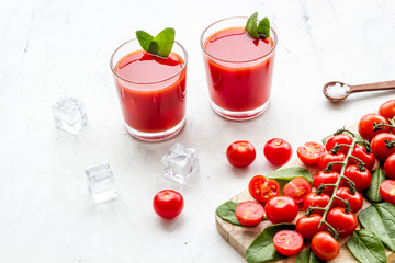 tomato juice, spinach and ice for summer healthy drink on white background