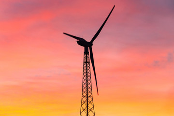Wind turbine at sunset