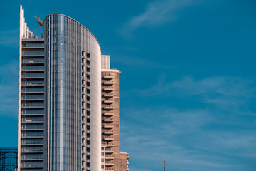 Office skyscraper on blue sky background. Modern city, business, success concept. Copy space area, place for text
