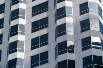 Office leasing concept. Windows of modern office building close up