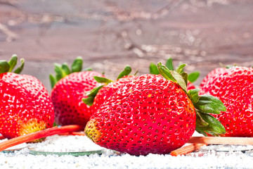 Red strawberries on wooden background