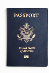 The iconic dark blue hard cover with gold stamping of an American passport set on a plain white background.