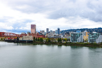 Panoramic view of Portland, Oregon downtown from river bank