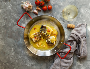 bacalao al pil pil, salted cod in emulsified olive oil sauce, spanish cuisine, basque country