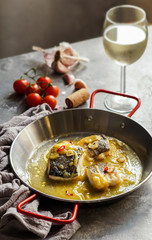 bacalao al pil pil, salted cod in emulsified olive oil sauce, spanish cuisine, basque country