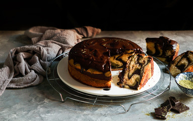 matcha green tea and chocolate cake. top view, copy space, grey background