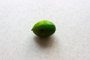 Green feijoa fruits on white background