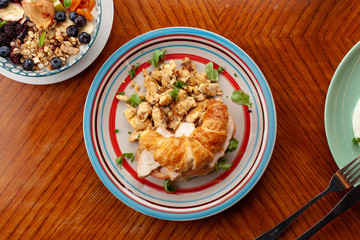 Lush croissant with chicken, soft cream cheese and scramble