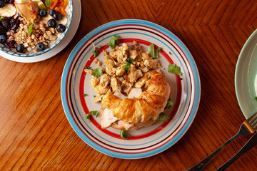 Lush croissant with chicken, soft cream cheese and scramble