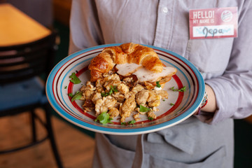 Lush croissant with chicken, soft cream cheese and scramble