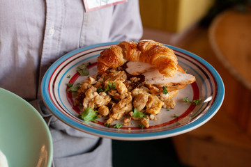 Lush croissant with chicken, soft cream cheese and scramble