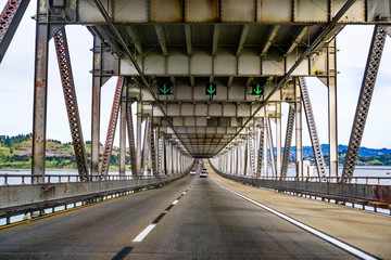 Fototapeta na wymiar Driving on Richmond - San Rafael bridge (John F. McCarthy Memorial Bridge), San Francisco bay, California