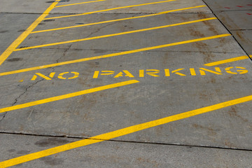 no parking sign in parking lot © rick