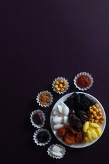 Eid Mubarak. Different iftar sweets. Celebrating Eid Al Adha. Islamic traditional holiday. Eid al-Fitr. Holly month Ramadan. Middle Eastern religious holiday. Dried date fruit. Flat lay, top view.