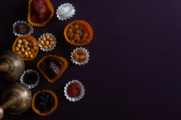 Eid Mubarak. Different iftar sweets. Celebrating Eid Al Adha. Islamic traditional holiday. Eid al-Fitr. Holly month Ramadan. Middle Eastern religious holiday. Dried date fruit. Flat lay, top view.