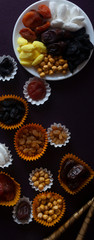 Eid Mubarak. Different iftar sweets. Celebrating Eid Al Adha. Islamic traditional holiday. Eid al-Fitr. Holly month Ramadan. Middle Eastern religious holiday. Dried date fruit. Flat lay, top view.