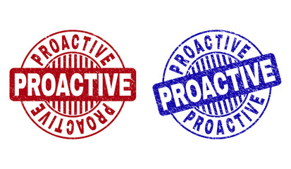 Grunge PROACTIVE round stamp seals isolated on a white background. Round seals with grunge texture in red and blue colors. Vector rubber imitation of PROACTIVE caption inside circle form with stripes.