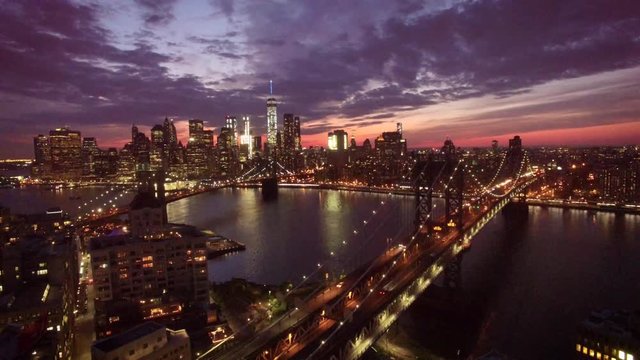 24P descending view of Manhattan over bridge