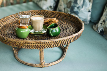Rattan tray with cappuccino.