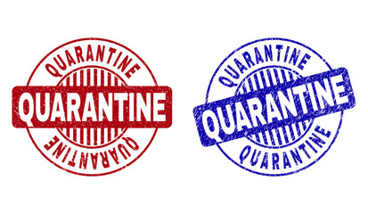 Grunge QUARANTINE round stamp seals isolated on a white background. Round seals with distress texture in red and blue colors.