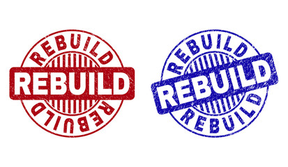 Grunge REBUILD round stamp seals isolated on a white background. Round seals with distress texture in red and blue colors. Vector rubber overlay of REBUILD label inside circle form with stripes.