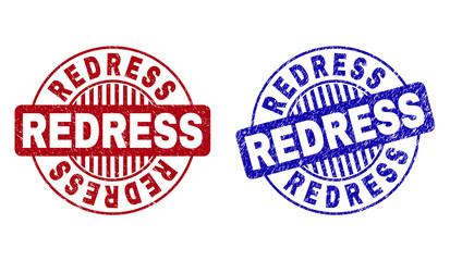 Grunge REDRESS round stamp seals isolated on a white background. Round seals with grunge texture in red and blue colors. Vector rubber watermark of REDRESS title inside circle form with stripes.