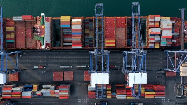 Aerial top view container cargo ship in import export business logistic and transportation of international by container cargo ship in the open sea, Time lapse aerial view.