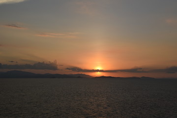 Naklejka na ściany i meble sunset over the sea leaving costa rica